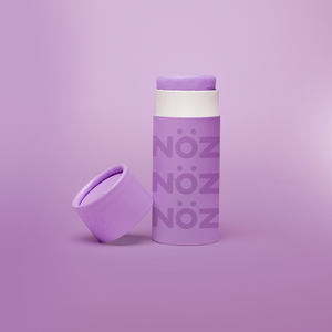 Front view of Nöz reef safe purple sunscreen